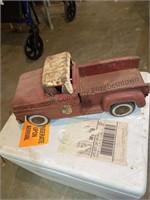 A vintage metal truck and 2 hook on grain wagons