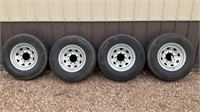 Set of four ST235/80R16 trailer wheels