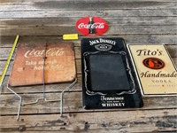 Vintage and modern Coca-Cola booze signs