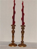 2 Red swirl candles with brass candlesticks