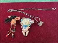 40" chain with pig pendant. Two pig brooches