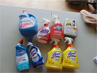 Lot of household cleaners. mostly full or sealed