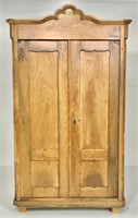 Fruitwood wardrobe, scalloped top, door panels