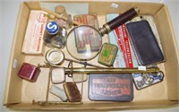 Two vintage magnifying glasses, 6 product tins