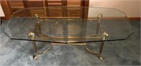 Brass ram head glass top coffee table