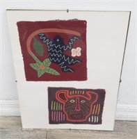 Pair of hand-sewn molas, unframed, under glass