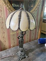 Statue lamp with slag glass dome shade