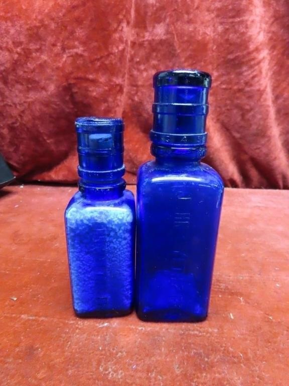 (2)Old cobalt blue medicine bottles w/dose cups.