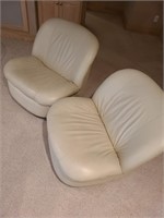 Pair of leather swivel rocking chairs. Basement ma