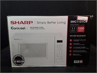New Sharp Carousel 1.1 cu ft Microwave Oven.