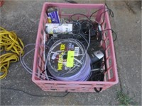 Crate w/weedeater twine and misc chargers