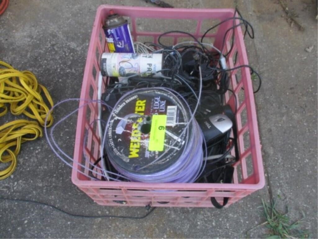 Crate w/weedeater twine and misc chargers