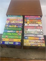 24 VHS Tapes In Storage Cabinet