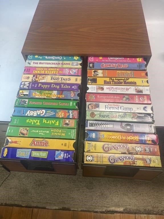 24 VHS Tapes In Storage Cabinet