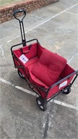 Red wagon and seat cushion sold as is.