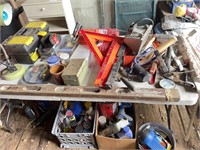 Assortment of tools, hardware. on and below table