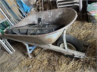 metal wheelbarrow with untested flat screen tv
