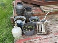 assorted outdoor pots and buckets