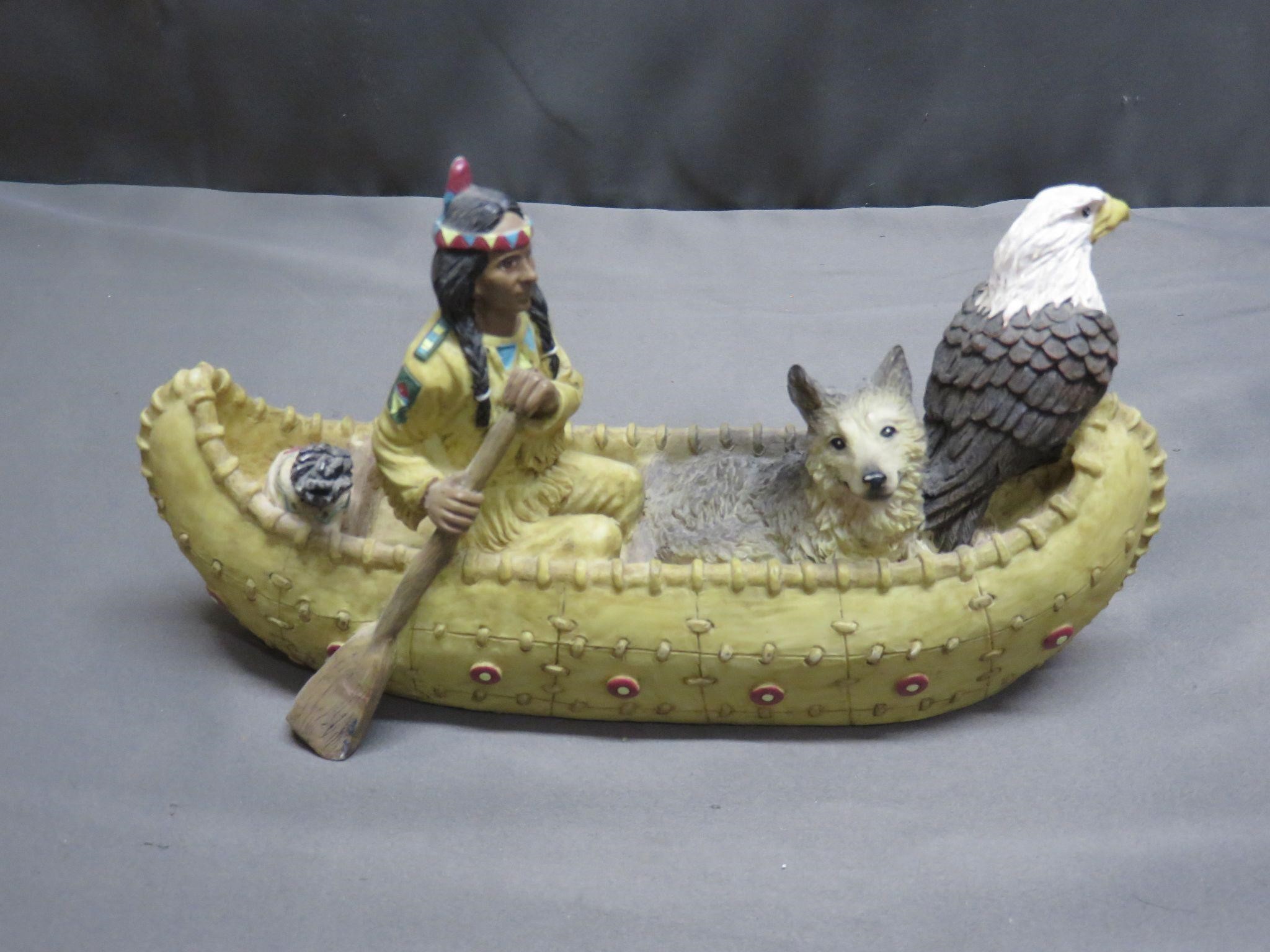 Indian on Canoe with Wolf and Eagle