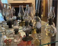 Seven Miniature Oil Lamps