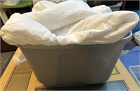 Tote full of mismatched sheets, pillow cases,