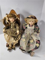 Two Porcelain Dolls Sitting in Chairs