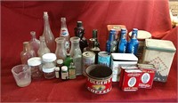 Assortment of glass bottles and tins