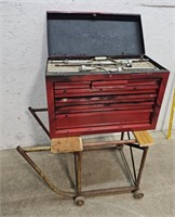 Toolbox with contents attached to cart
