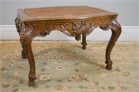 French caned and carved wood ottoman