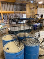 PLASTIC DRUMS AND DOG CRATES