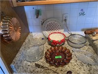 LOT OF GLASSWARE/ KITCHEN MOLDS HANGING