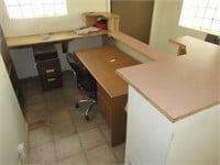 Office desk with file cabinet, book shelf and