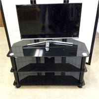 Samsung TV with Black Glass Stand