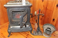 Cast iron wood stove with insert and tools