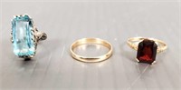 3 rings including 14K gold band, 10K ring with red