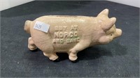 This adorable pink pig cast iron bank is a Norco