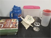 Large group of cookbooks, cereal holders,