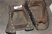 PAIR OF OLD STIRRUPS WITH LEATHER SURROUND