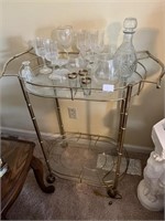 BEAUTIFUL GLASS SHELVING USED AS BAR CART