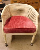 Cane & faux bamboo barrel back chair on casters