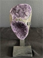 Amethyst quartz crystal specimen on stand