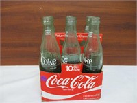 6 Coca Cola Bottles in a Cardboard Carrier