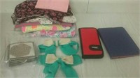 Group of fabric, bows, iPad case, and wallet