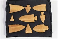 9 CARVED WOODEN POINTS IN DISPLAY