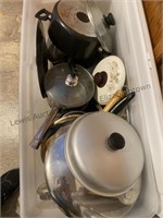 Large tote of pots and pans and lids. And a box
