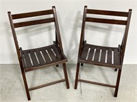 Pair of wooden outdoor folding chairs