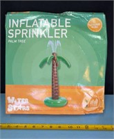 Inflatable palm tree sprinkler. New in box