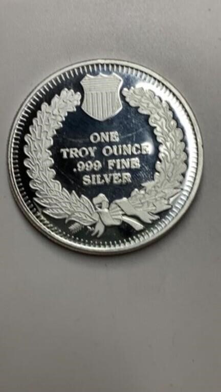 One TROY ounce .999 fine silver round