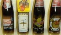 8 COMMEMORATIVE COKE BOTTLES