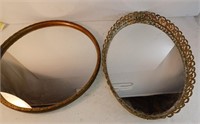 D4) 2 vintage vanity mirrors.